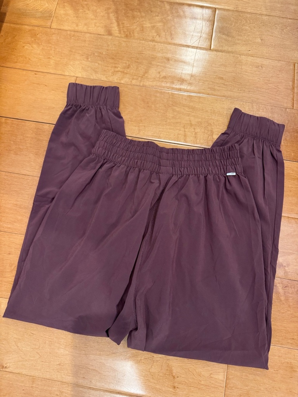 Vuori Women's Track Pants in Deep Plum